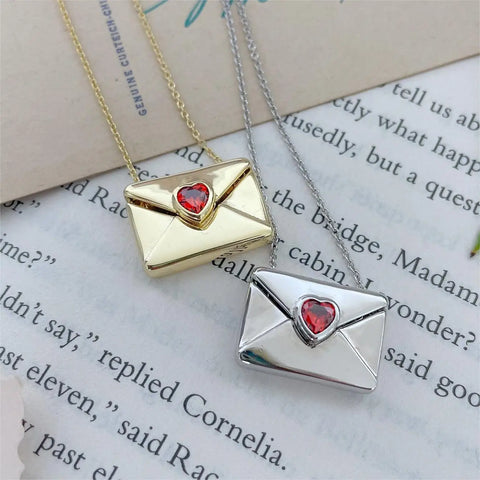 A copper envelope necklace inlaid with red hearts